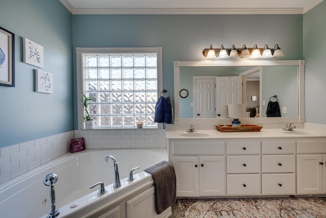 bathroom with ornamental molding, vanity, and a bathtub