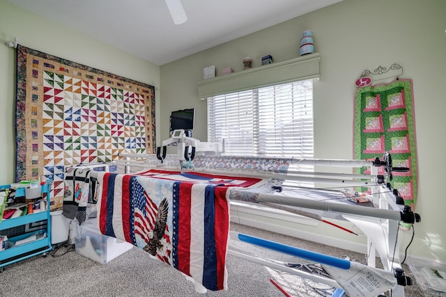 bedroom featuring ceiling fan and carpet flooring