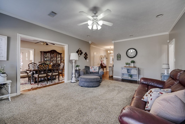 living room with crown molding and ceiling fan with notable chandelier