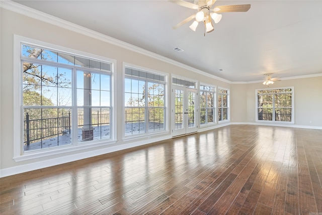 unfurnished living room featuring ceiling fan, ornamental molding, and dark hardwood / wood-style floors