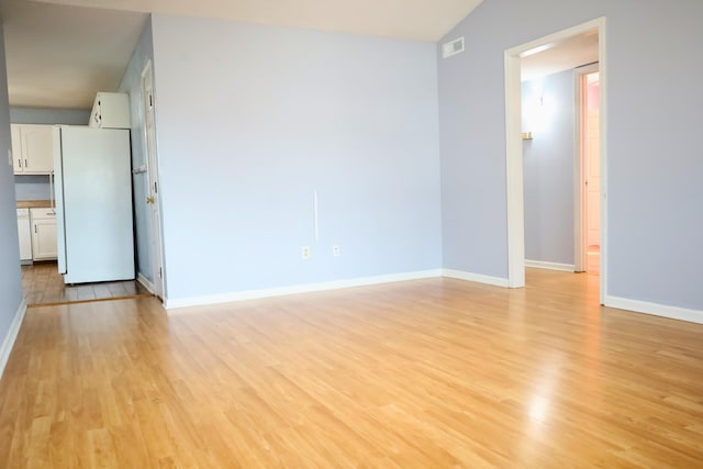 unfurnished living room with light wood-type flooring