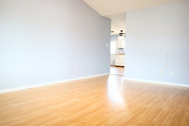 spare room with ceiling fan and light hardwood / wood-style floors