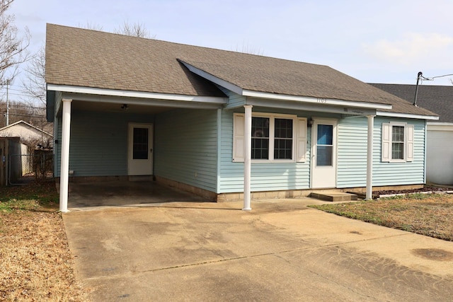 single story home featuring a carport