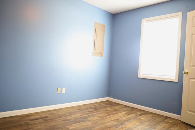 unfurnished room featuring hardwood / wood-style floors