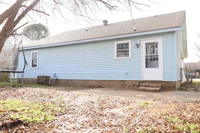 back of house featuring cooling unit and a patio area