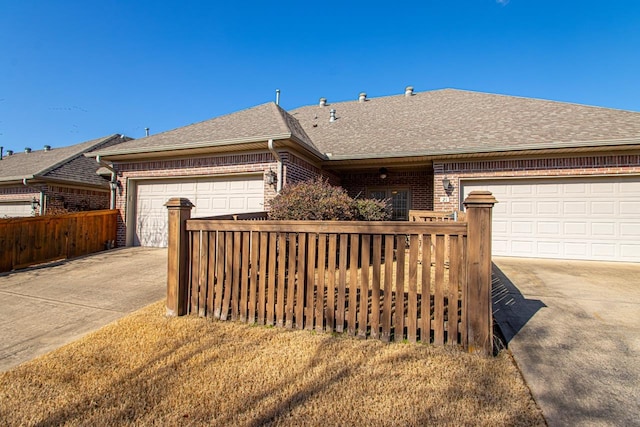 single story home featuring a garage