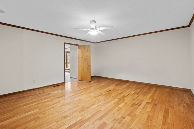 empty room with crown molding, ceiling fan, and light wood-type flooring