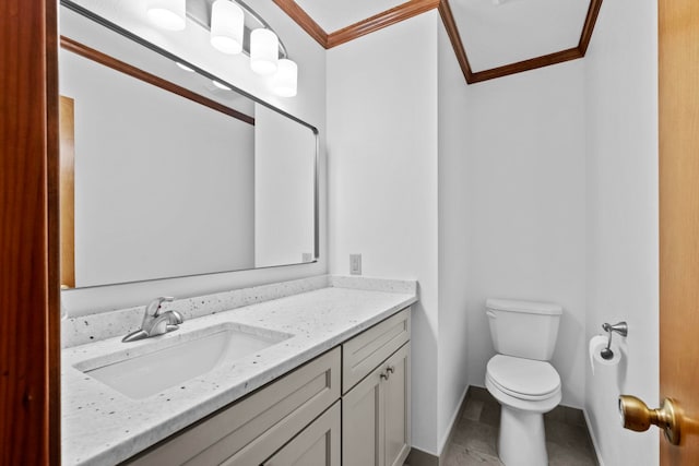 bathroom featuring vanity, crown molding, tile patterned floors, and toilet