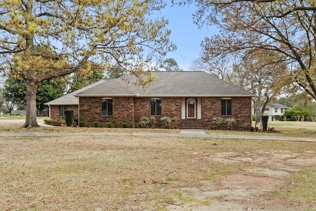 single story home with a front lawn