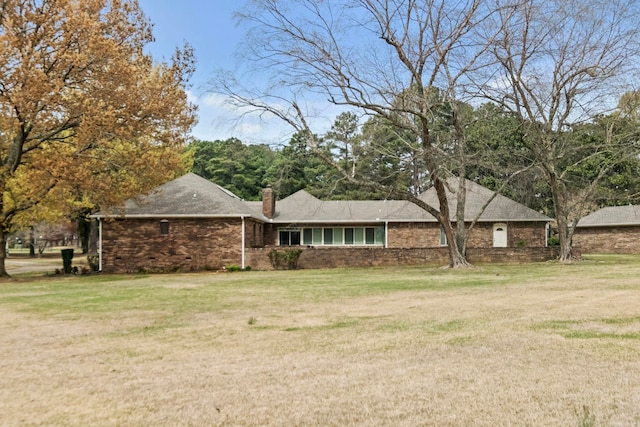 ranch-style home with a front yard