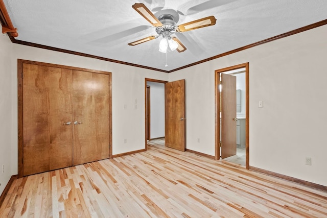 unfurnished bedroom with crown molding, a closet, ceiling fan, and light wood-type flooring