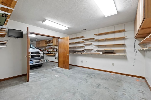 basement featuring a textured ceiling