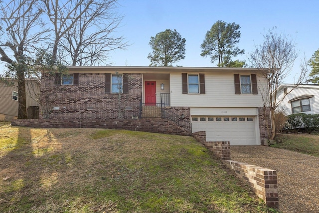 view of front of property featuring a garage and a front lawn