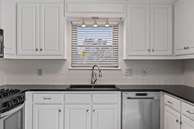 kitchen with tasteful backsplash, sink, stainless steel appliances, and white cabinets