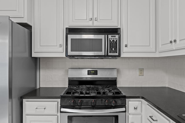 kitchen with appliances with stainless steel finishes, decorative backsplash, and white cabinets