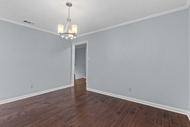 empty room with crown molding, dark hardwood / wood-style floors, and an inviting chandelier