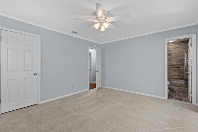 unfurnished bedroom with crown molding, light carpet, ceiling fan, and ensuite bathroom