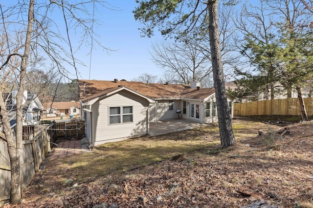 rear view of house with a patio