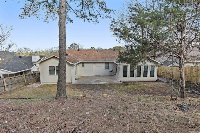 back of house with a patio