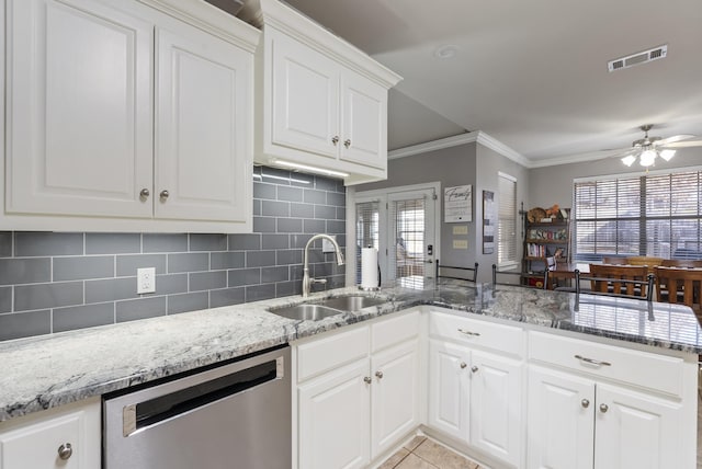 kitchen featuring white cabinetry, dishwasher, sink, and kitchen peninsula