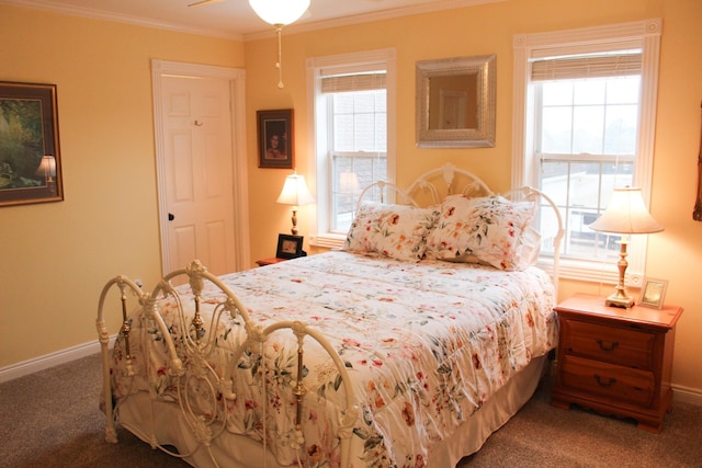 bedroom with ornamental molding and carpet