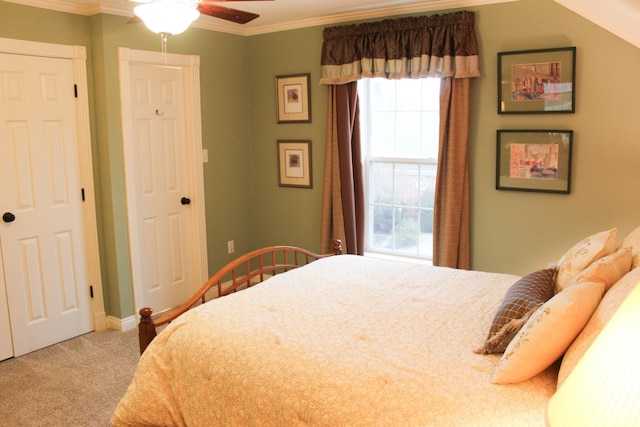 bedroom with crown molding, carpet floors, and ceiling fan