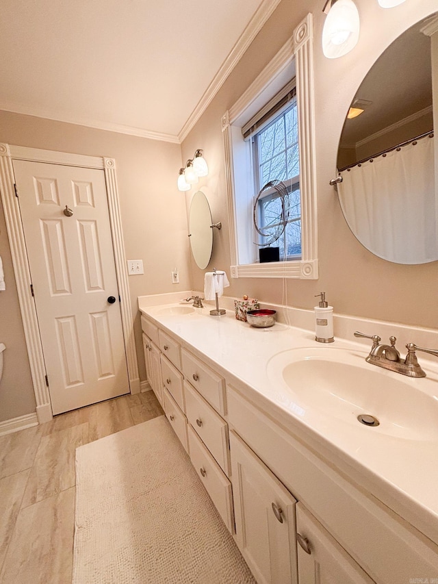 bathroom with crown molding and vanity