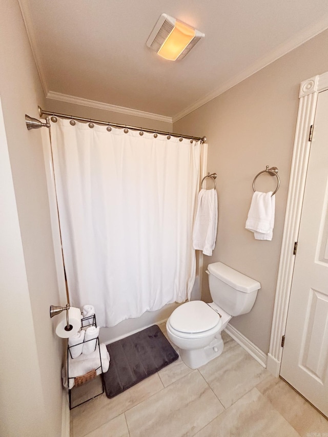 bathroom with ornamental molding, shower / bath combo with shower curtain, and toilet