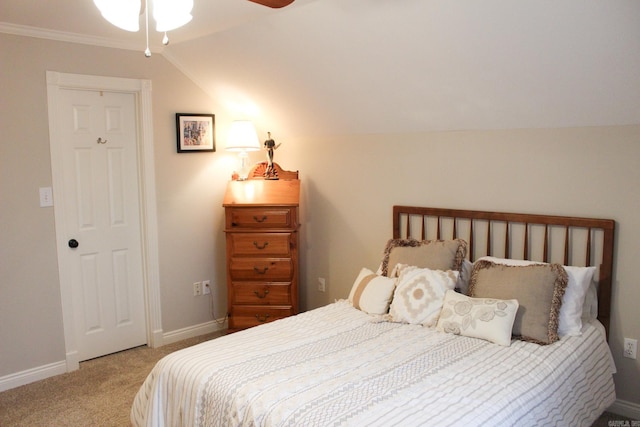 bedroom with vaulted ceiling and carpet