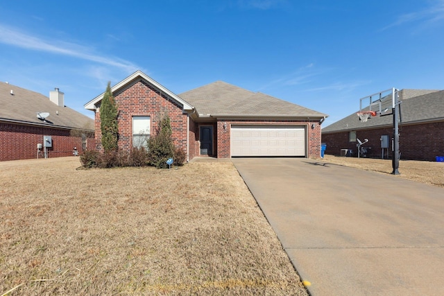 view of front of house featuring a garage and a front lawn