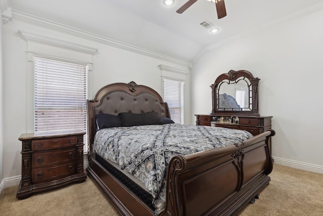 bedroom with vaulted ceiling, ornamental molding, light colored carpet, and ceiling fan