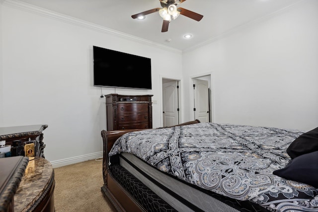 carpeted bedroom featuring ornamental molding and ceiling fan