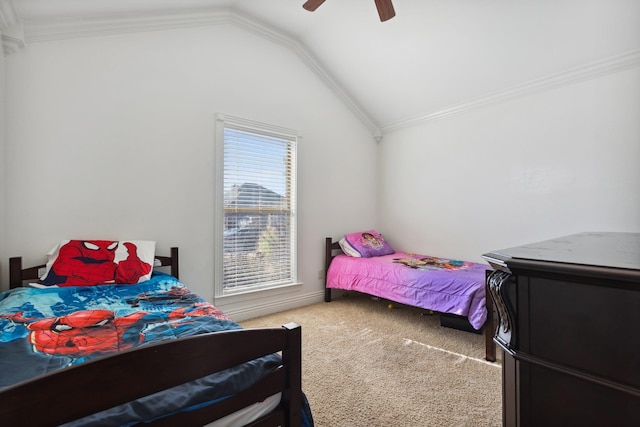 bedroom featuring vaulted ceiling, ceiling fan, ornamental molding, and carpet floors