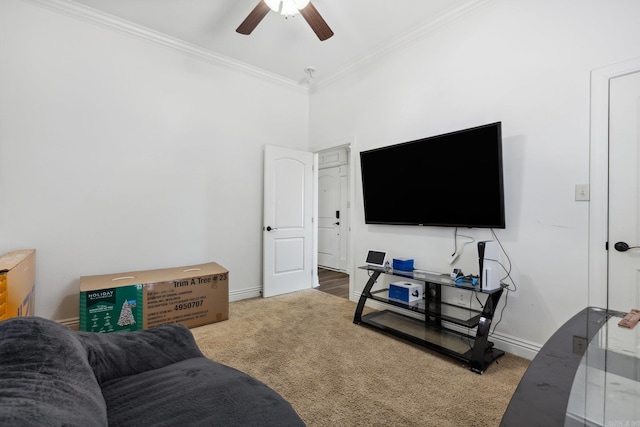 carpeted living room with ornamental molding and ceiling fan