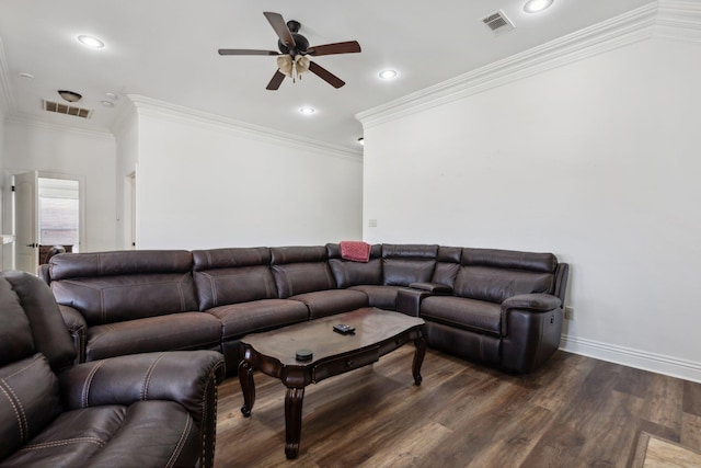 living room with crown molding, dark wood-type flooring, and ceiling fan