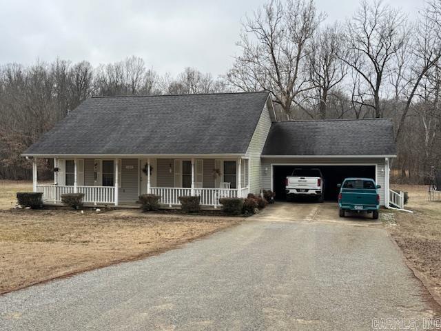 view of front facade featuring a garage and covered porch