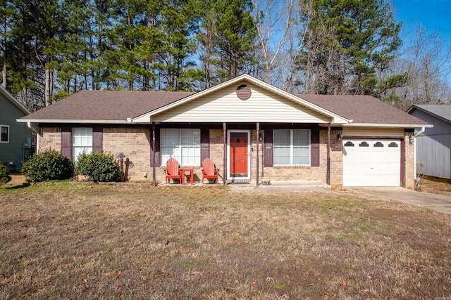 ranch-style house featuring a garage and a front lawn