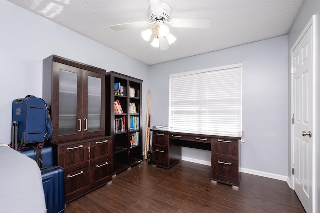 office featuring ceiling fan, dark hardwood / wood-style floors, and a textured ceiling