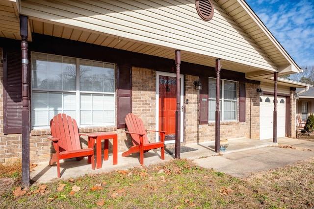 doorway to property with a garage