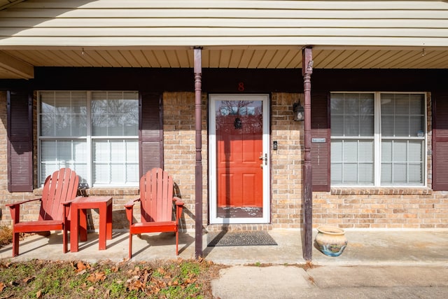 doorway to property featuring covered porch