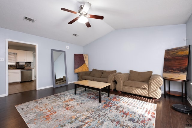 living room with lofted ceiling, dark hardwood / wood-style floors, and ceiling fan