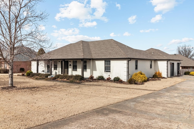 view of front of home featuring brick siding, an attached garage, roof with shingles, covered porch, and driveway