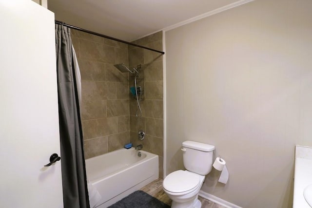 full bathroom featuring vanity, shower / tub combo with curtain, and toilet