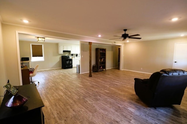 living room with crown molding, hardwood / wood-style flooring, and ceiling fan