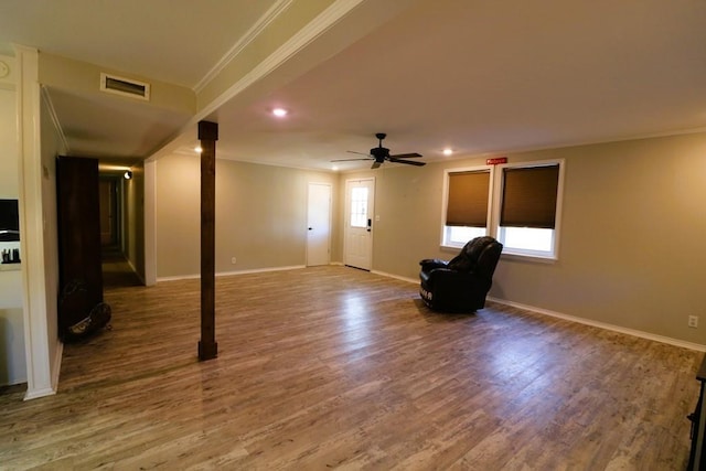 interior space featuring crown molding, ceiling fan, and hardwood / wood-style floors