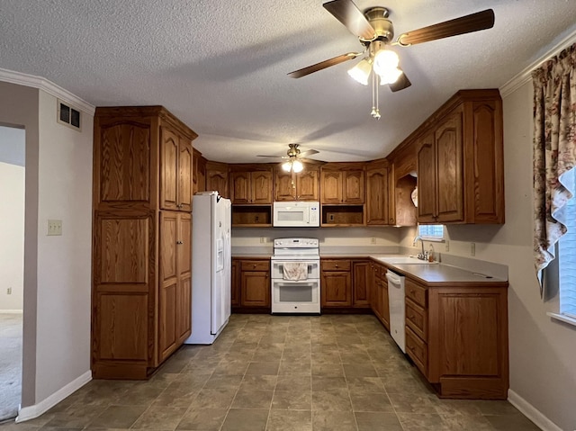 kitchen with ceiling fan, sink, a textured ceiling, and white appliances