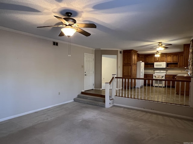 interior space featuring ornamental molding, sink, ceiling fan, and a textured ceiling