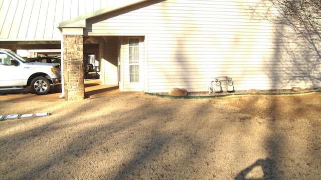 view of home's exterior with a carport