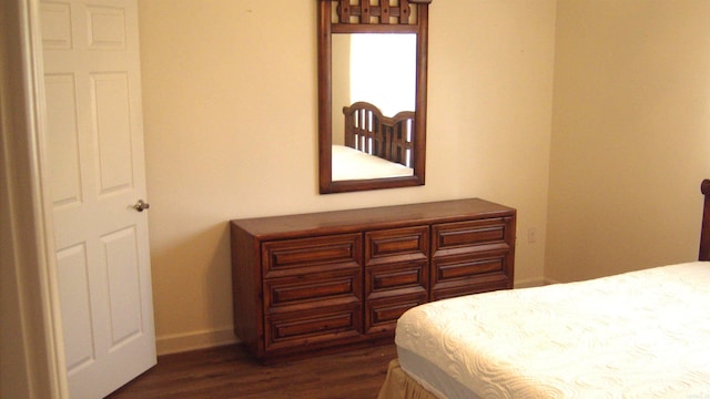 bedroom featuring dark hardwood / wood-style flooring