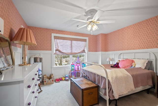 bedroom featuring light carpet and ceiling fan